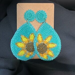 Beaded turquoise colored sunflower earrings